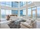 Bright living room with floor-to-ceiling windows and modern white sofas with a beautiful city view at 2700 Las Vegas Blvd # 4305, Las Vegas, NV 89109