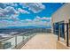 Enjoy breathtaking city views from this expansive terrace featuring glass railings and durable tile flooring at 2700 Las Vegas Blvd # 4305, Las Vegas, NV 89109