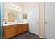 Bathroom featuring a double sink vanity and wood-look flooring, and ample storage at 2781 Dunstan Way, Las Vegas, NV 89123
