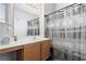 Bathroom featuring neutral decor, a modern vanity, and a shower with a decorative curtain at 2781 Dunstan Way, Las Vegas, NV 89123