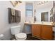 Bathroom with a wood vanity, modern fixtures, and a bright window at 2781 Dunstan Way, Las Vegas, NV 89123