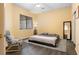 Cozy bedroom with carpet flooring, contemporary decor, window and comfortable bed at 2781 Dunstan Way, Las Vegas, NV 89123
