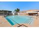 Resort-style community pool with lounge chairs, tables, and well-maintained grounds at 2781 Dunstan Way, Las Vegas, NV 89123