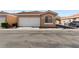 Single-story home with a two-car garage and desert landscaping at 2781 Dunstan Way, Las Vegas, NV 89123