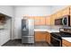 Well-organized kitchen offering stainless steel refrigerator, gas range, and ample cabinet space at 2781 Dunstan Way, Las Vegas, NV 89123