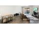 Bright living room features modern furnishings and sliding door access to outdoor area at 2781 Dunstan Way, Las Vegas, NV 89123