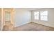 Bright bedroom with carpet flooring and plenty of natural light from dual windows at 2887 Starling Summit St, Henderson, NV 89044