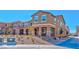 Inviting townhome with covered entryway, stone accents, and drought-tolerant landscaping at 2887 Starling Summit St, Henderson, NV 89044