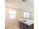 Modern kitchen island with stainless steel sink, dishwasher and ample natural light at 2887 Starling Summit St, Henderson, NV 89044