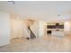 Spacious open floor plan connecting the kitchen and living area with tile flooring at 2887 Starling Summit St, Henderson, NV 89044
