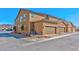 Townhome exterior featuring attached two-car garages and low-maintenance landscaping at 2887 Starling Summit St, Henderson, NV 89044