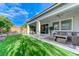 Lush backyard with a covered patio perfect for relaxing and entertaining guests at 3144 Tronzano Ave, Henderson, NV 89044