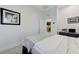 Bright bedroom featuring a bed, artwork, and an attached laundry area at 3144 Tronzano Ave, Henderson, NV 89044
