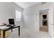 Bright bedroom featuring a closet with sliding doors and an adjacent laundry room at 3144 Tronzano Ave, Henderson, NV 89044