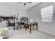 Spacious bedroom with a cozy chair, complete with bookshelves, a desk, and ample natural light at 3144 Tronzano Ave, Henderson, NV 89044