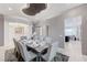 Dining room with stylish decor, unique ceiling detail, and seating for ten at 3144 Tronzano Ave, Henderson, NV 89044
