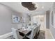 Well-appointed dining room with seating for ten and modern lighting at 3144 Tronzano Ave, Henderson, NV 89044