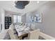 Elegant dining room featuring a modern light fixture, textured walls, and seating for ten at 3144 Tronzano Ave, Henderson, NV 89044