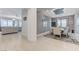 Open-concept living space with dining area featuring seating for eight, and light gray color palette at 3144 Tronzano Ave, Henderson, NV 89044