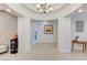 Bright entryway featuring arched openings leading to various rooms, with stylish decor and art at 3144 Tronzano Ave, Henderson, NV 89044
