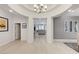 Spacious entryway with an arched opening leading to the living area and tile flooring at 3144 Tronzano Ave, Henderson, NV 89044