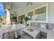 Covered patio with elegant seating area extending to landscaped backyard at 3144 Tronzano Ave, Henderson, NV 89044