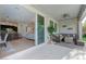 Open patio view to the kitchen and living room with bar seating at 3144 Tronzano Ave, Henderson, NV 89044