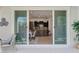 View from the patio through sliding glass doors to the kitchen and dining area at 3144 Tronzano Ave, Henderson, NV 89044