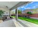 Covered patio overlooking a well-maintained backyard with artificial grass at 3144 Tronzano Ave, Henderson, NV 89044
