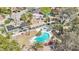 Aerial view of home with in-ground pool and spa, solar panels, and mature landscaping at 3155 Duneville St, Las Vegas, NV 89146
