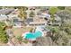 Aerial view of home with a solar panel system, inground pool, spa and mature landscaping at 3155 Duneville St, Las Vegas, NV 89146