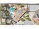 Overhead view of a home with an in-ground pool and spa, solar panels and mature landscaping at 3155 Duneville St, Las Vegas, NV 89146