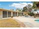 Expansive backyard featuring a pool, patio, and mature landscaping, perfect for entertaining and outdoor activities at 3155 Duneville St, Las Vegas, NV 89146