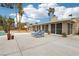 Backyard patio with lounge chairs and view of the screened-in porch at 3155 Duneville St, Las Vegas, NV 89146