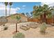 Expansive backyard featuring desert landscaping, mature trees, and raised garden beds perfect for gardening enthusiasts at 3155 Duneville St, Las Vegas, NV 89146