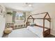 Cozy bedroom featuring a house frame bed, window nook with storage, and soft natural lighting at 3155 Duneville St, Las Vegas, NV 89146