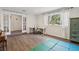 Versatile bonus room with natural light, wood floors, and a play area, offering flexible space for various activities at 3155 Duneville St, Las Vegas, NV 89146