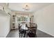 Inviting dining room with a classic table setting, bright natural light, and decorative shelves, perfect for gatherings at 3155 Duneville St, Las Vegas, NV 89146