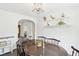 Charming dining room with a traditional table, decorative shelves, and ample natural light, creating a welcoming atmosphere at 3155 Duneville St, Las Vegas, NV 89146