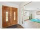 Grand entryway featuring wood floors and an open layout, providing a seamless transition to the bonus room at 3155 Duneville St, Las Vegas, NV 89146