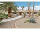 Inviting single-story home with desert landscaping, mature palm trees, and a charming walkway at 3155 Duneville St, Las Vegas, NV 89146