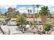 Beautiful home with desert landscaping, mature trees, double-door entry, and a gated driveway at 3155 Duneville St, Las Vegas, NV 89146
