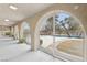 A long patio with arched openings offers beautiful views of the sparkling swimming pool at 3155 Duneville St, Las Vegas, NV 89146