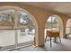 Covered patio featuring arched entryways leading to a pool and outdoor seating area at 3155 Duneville St, Las Vegas, NV 89146