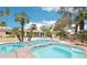 Gorgeous backyard pool with spa and beautiful landscaping that complements the home's exterior at 3155 Duneville St, Las Vegas, NV 89146