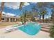 Inviting backyard pool with diving board, spa and landscaping creating an ideal oasis for relaxation and entertainment at 3155 Duneville St, Las Vegas, NV 89146