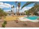 This backyard pool features a diving board, landscaping and an inviting retreat at 3155 Duneville St, Las Vegas, NV 89146
