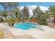Backyard pool and diving board with a spa and lush landscaping for ultimate outdoor enjoyment and relaxation at 3155 Duneville St, Las Vegas, NV 89146