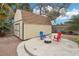 Spacious shed with adjacent patio area complete with seating and a fire pit at 3155 Duneville St, Las Vegas, NV 89146