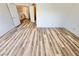 Bright bedroom boasting laminate flooring and a view of the second floor landing at 3919 Lilac Haze St, Las Vegas, NV 89147